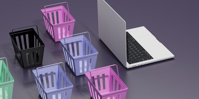 a laptop and baskets on a table